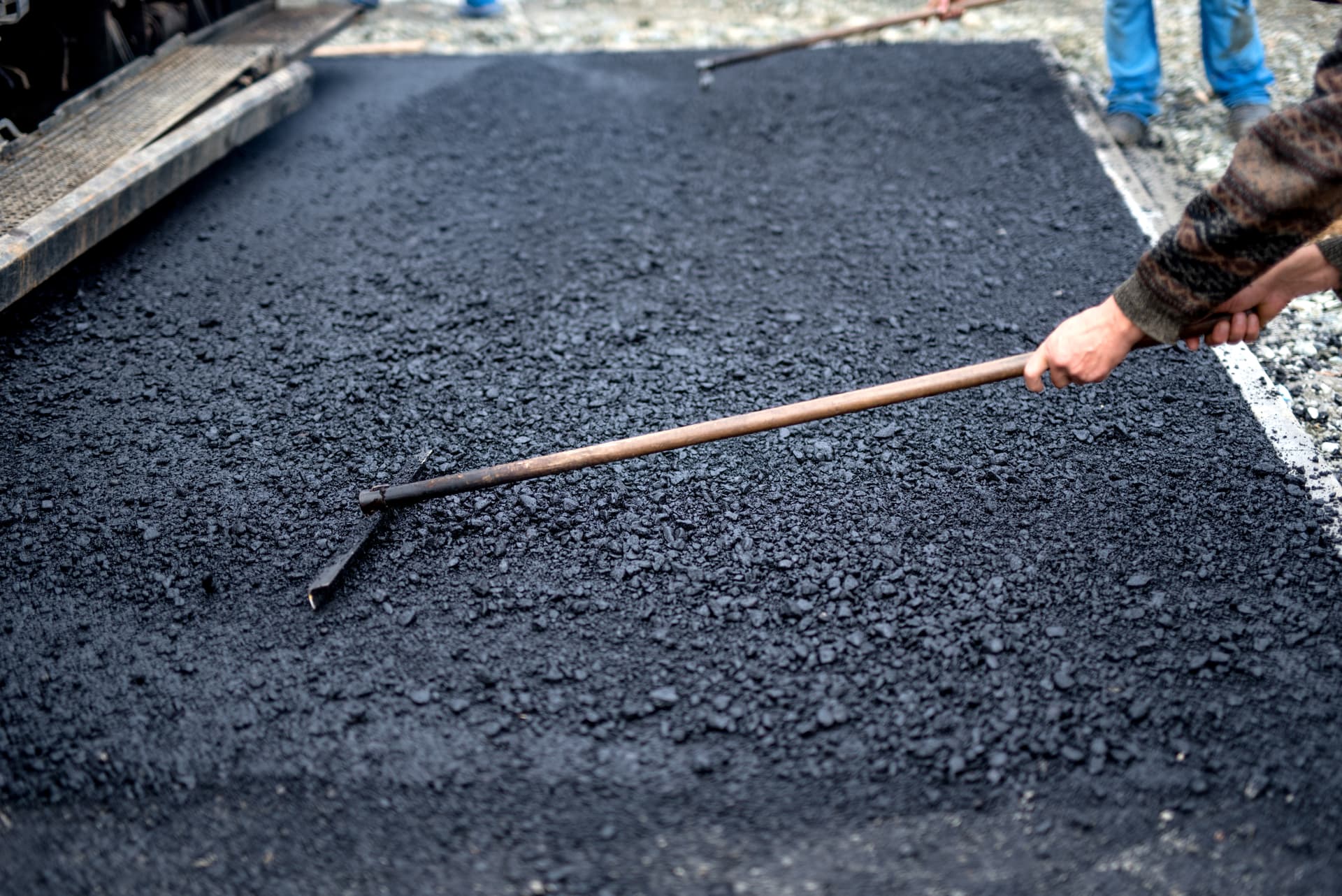 Fresh asphalt overlay on commercial parking lot